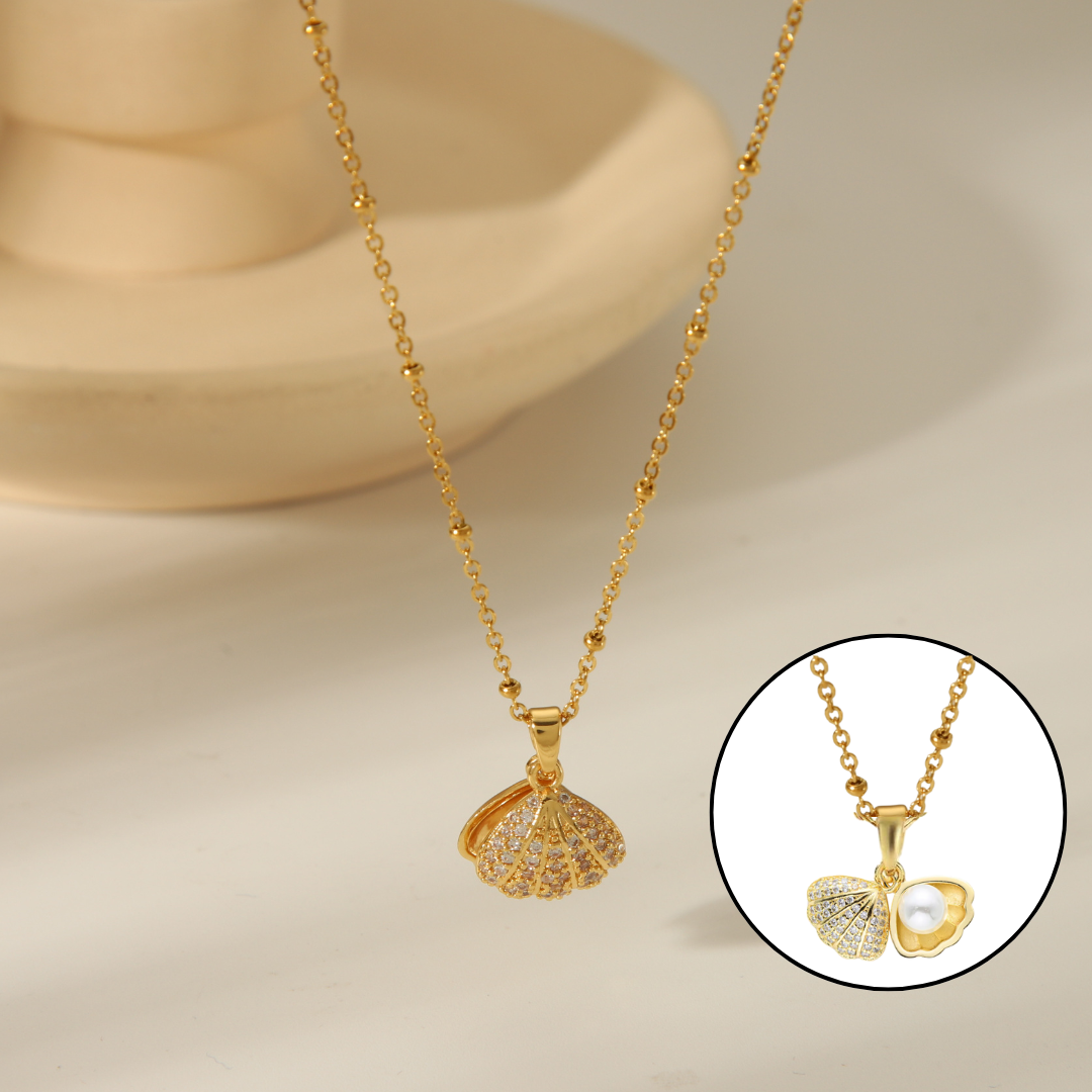 Perla en su concha oro