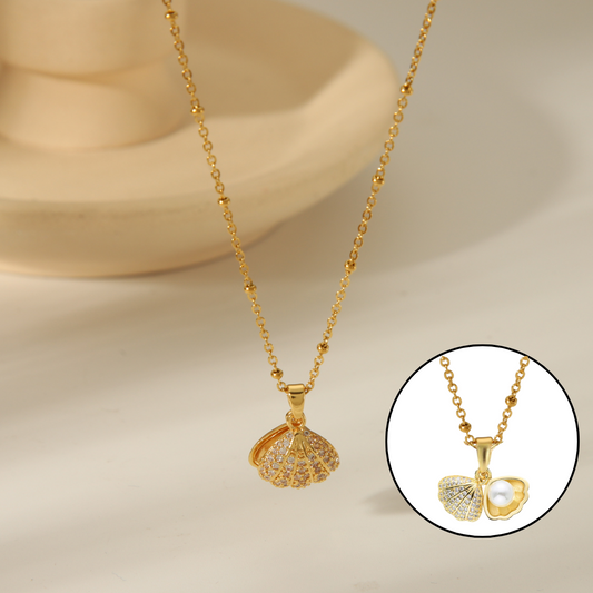 Perla en su concha oro